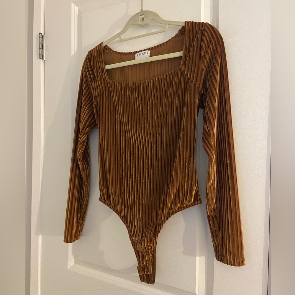 Gold/caramel long sleeved ribbed body suit. Never worn!